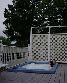 Soak your cares away in our outdoor hot tub - Plain & Fancy BB